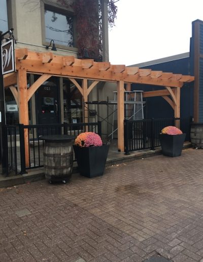 Beautiful custom-built pergola with natural wood finish for outdoor patio enhancement.