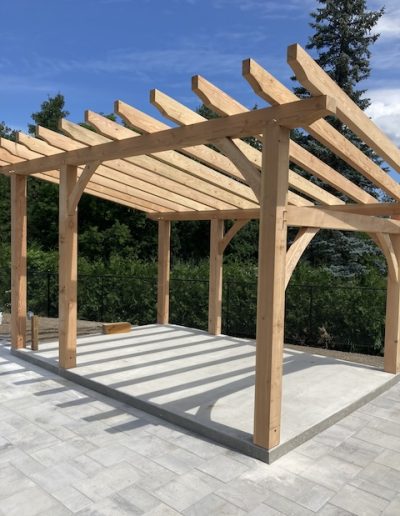 Custom wooden pergola outdoor structure by Bytown Timberworks in Ottawa. Durable, handcrafted timber framing for patios.