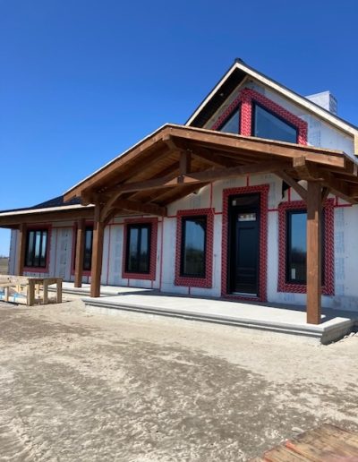 Stunning custom timber frame home with natural wood accents. Expert craftsmanship by Bytown Timberworks.
